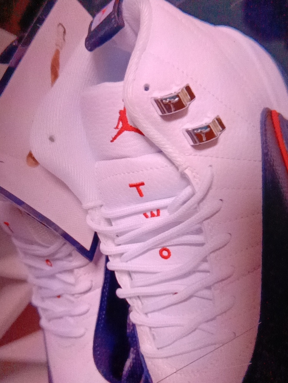 Jordan Men's White Athletic Sneakers with Red and Blue Accents